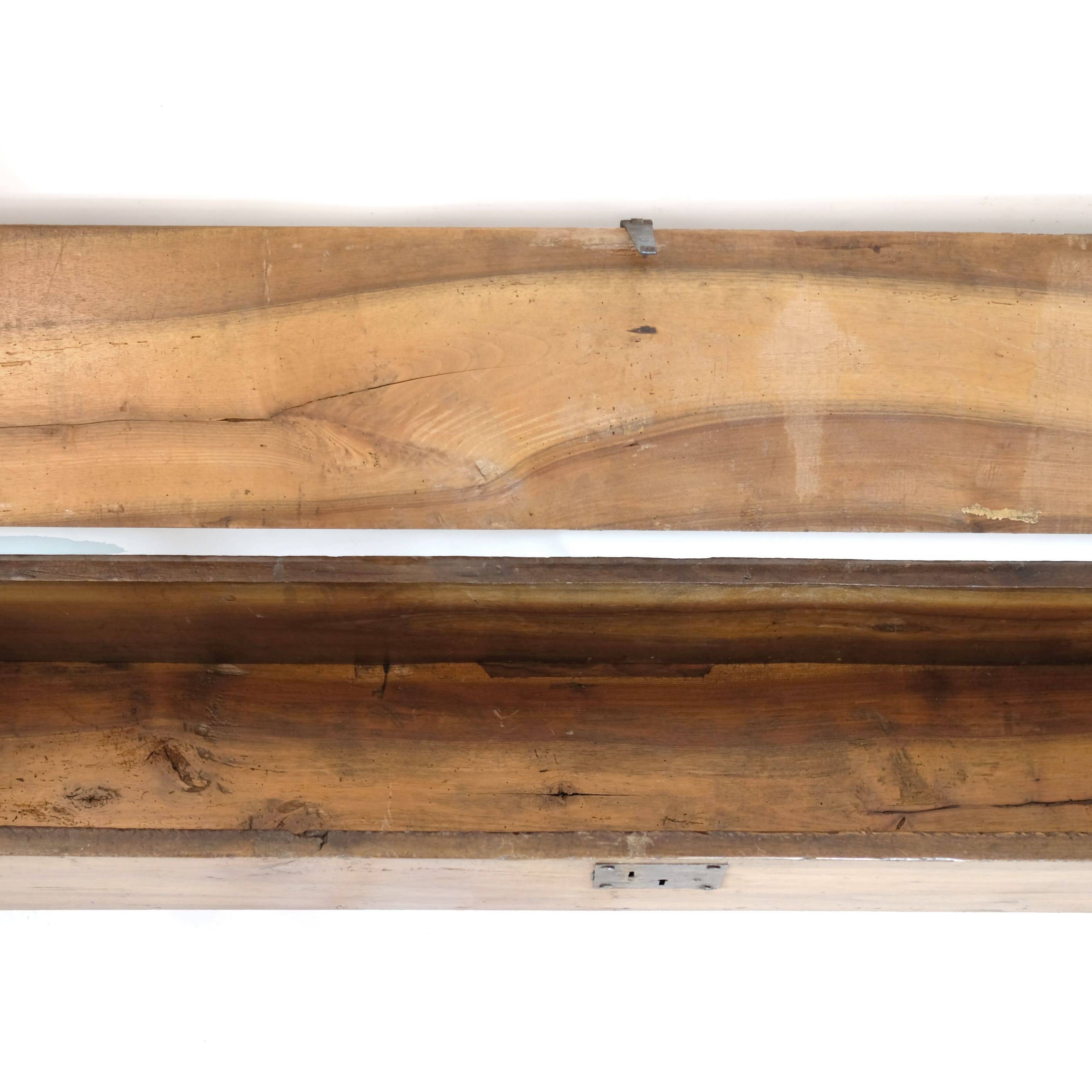 Long walnut grain chest forming a bench, 220cm.