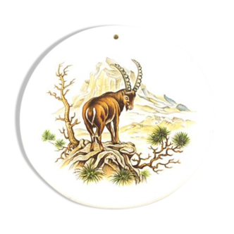 White round coaster with hanging ibex