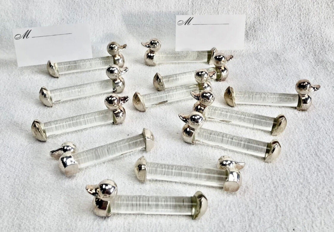 12 silver-plated metal duck knife rests with crystal.