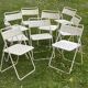 Set of 9 vintage perforated metal folding chairs from the 1970s-80s.