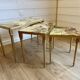 Set of 3 vintage nesting tables in onyx and gold metal from the 1970s.