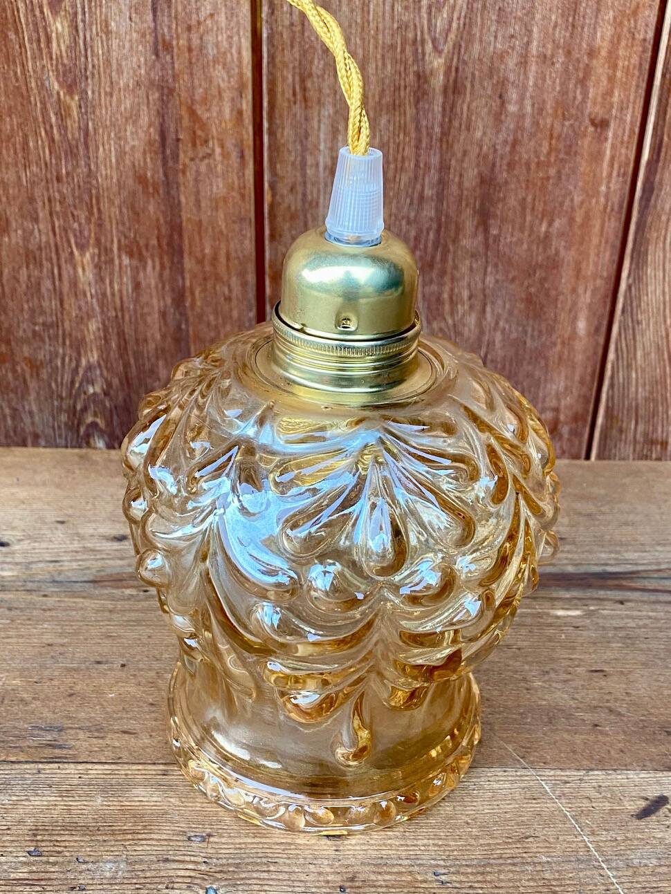 Vintage cut amber glass suspension globe.