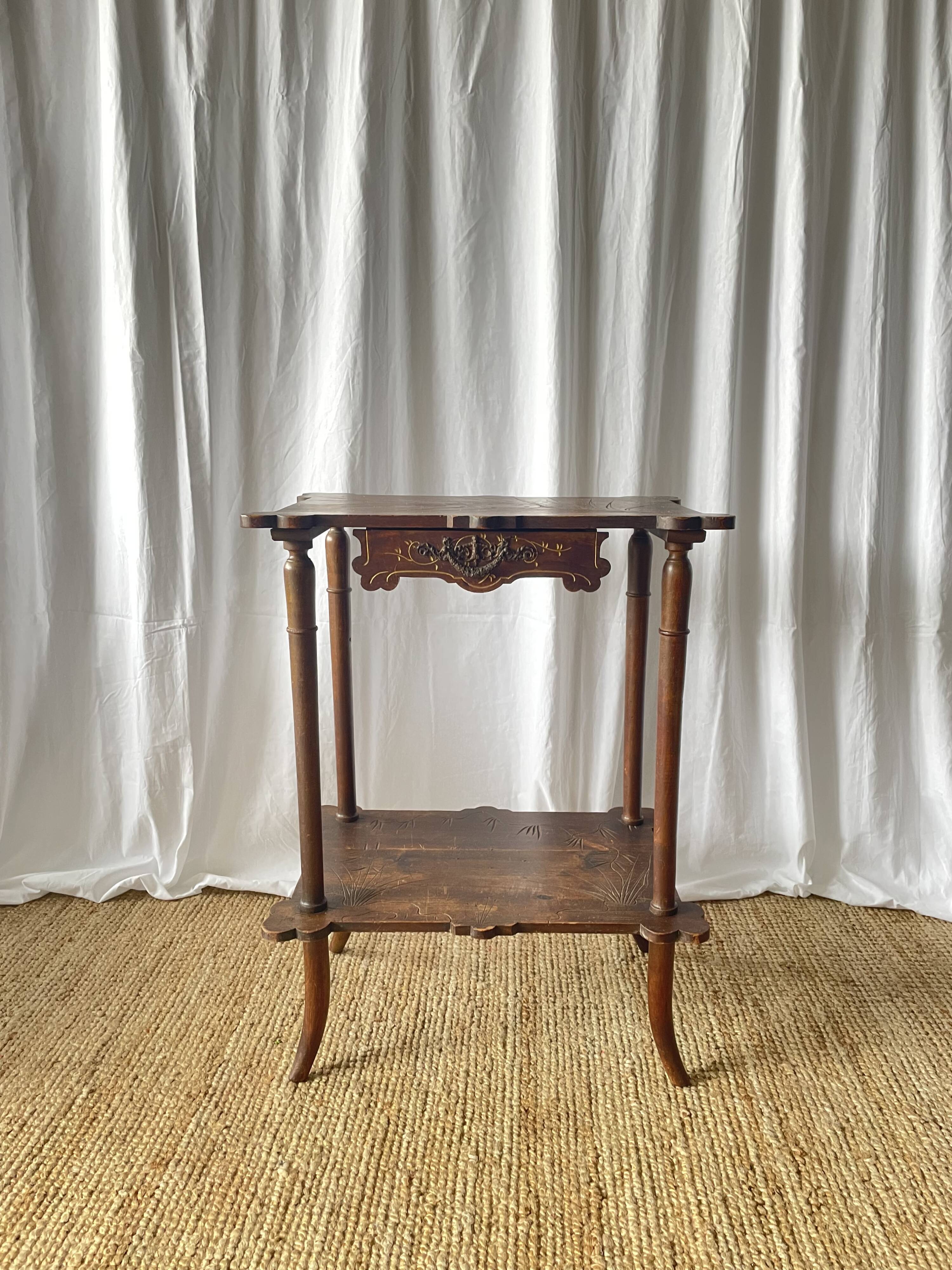 Elegant Art Nouveau side table in walnut, France early 20th century.