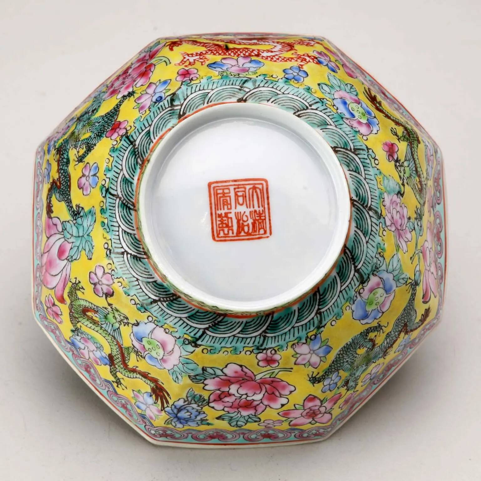 Vintage porcelain bowl decorated with dragons and flowers, China, 1980s.