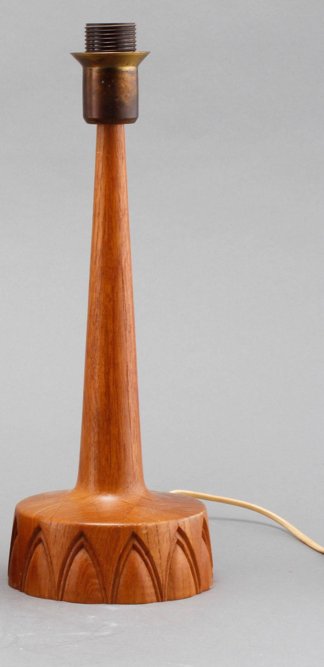 Sculpted teak table lamps for Ab Stilarmatur Tranas, Sweden, 1960.