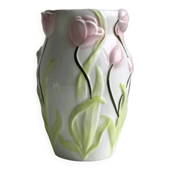 Planter or umbrella stand in white slip with floral decoration in pink and green relief.