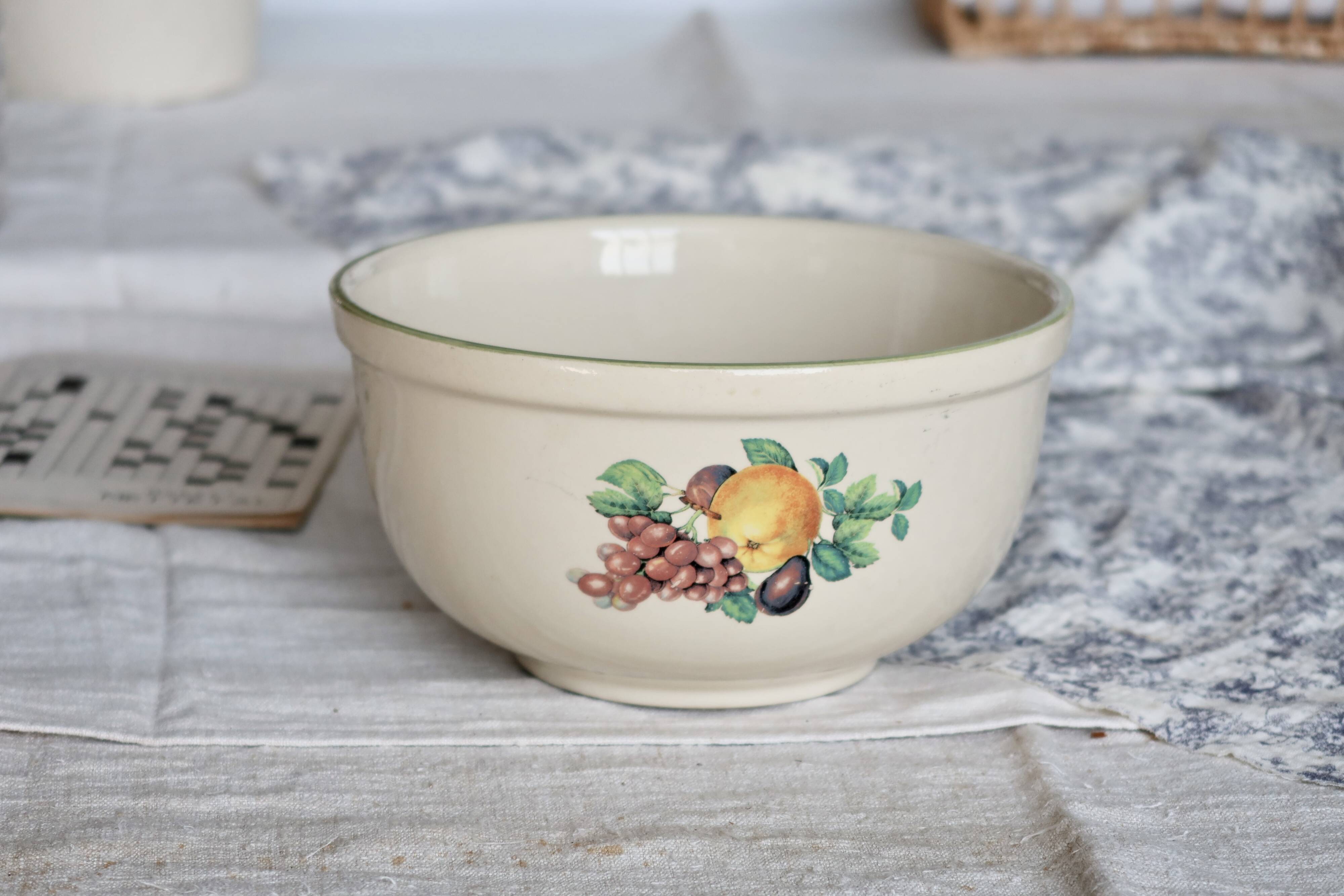 Vintage round earthenware salad bowl with fruit pattern