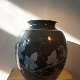 Black vase with plant decoration by Philippe Jacques