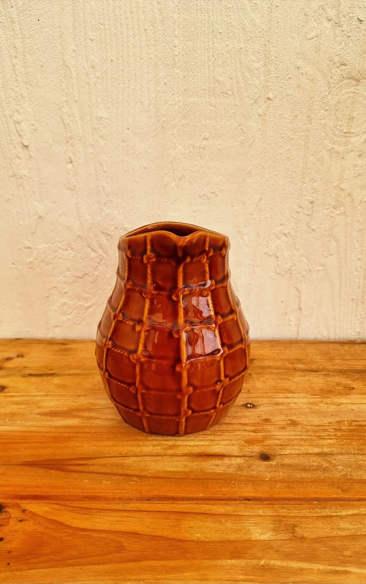 Vintage Saint Clément pitcher with a caramel checkered design.