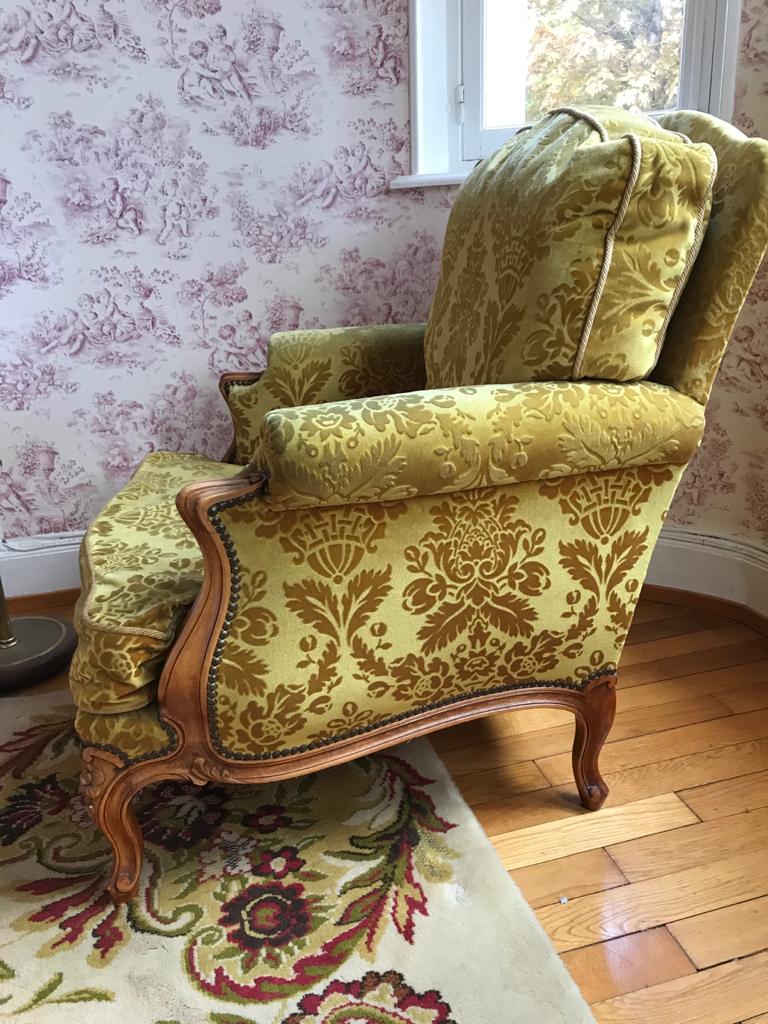 Armchair in golden yellow velvet and louis XV style cherry tree