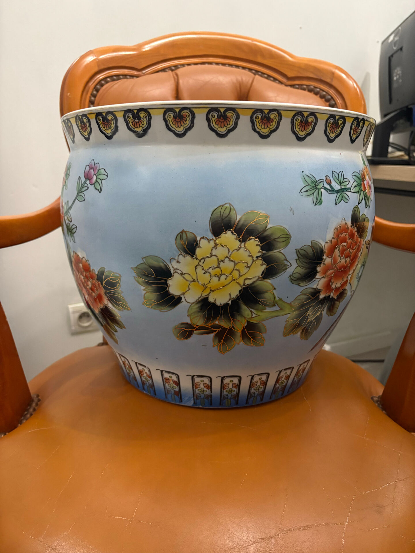 Antique porcelain vase with floral and bird decoration.