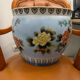 Antique porcelain vase with floral and bird decoration.