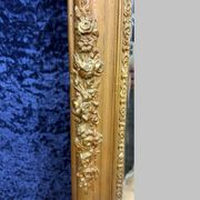Empire period mirror in wood and gilded stucco circa 1810-1820