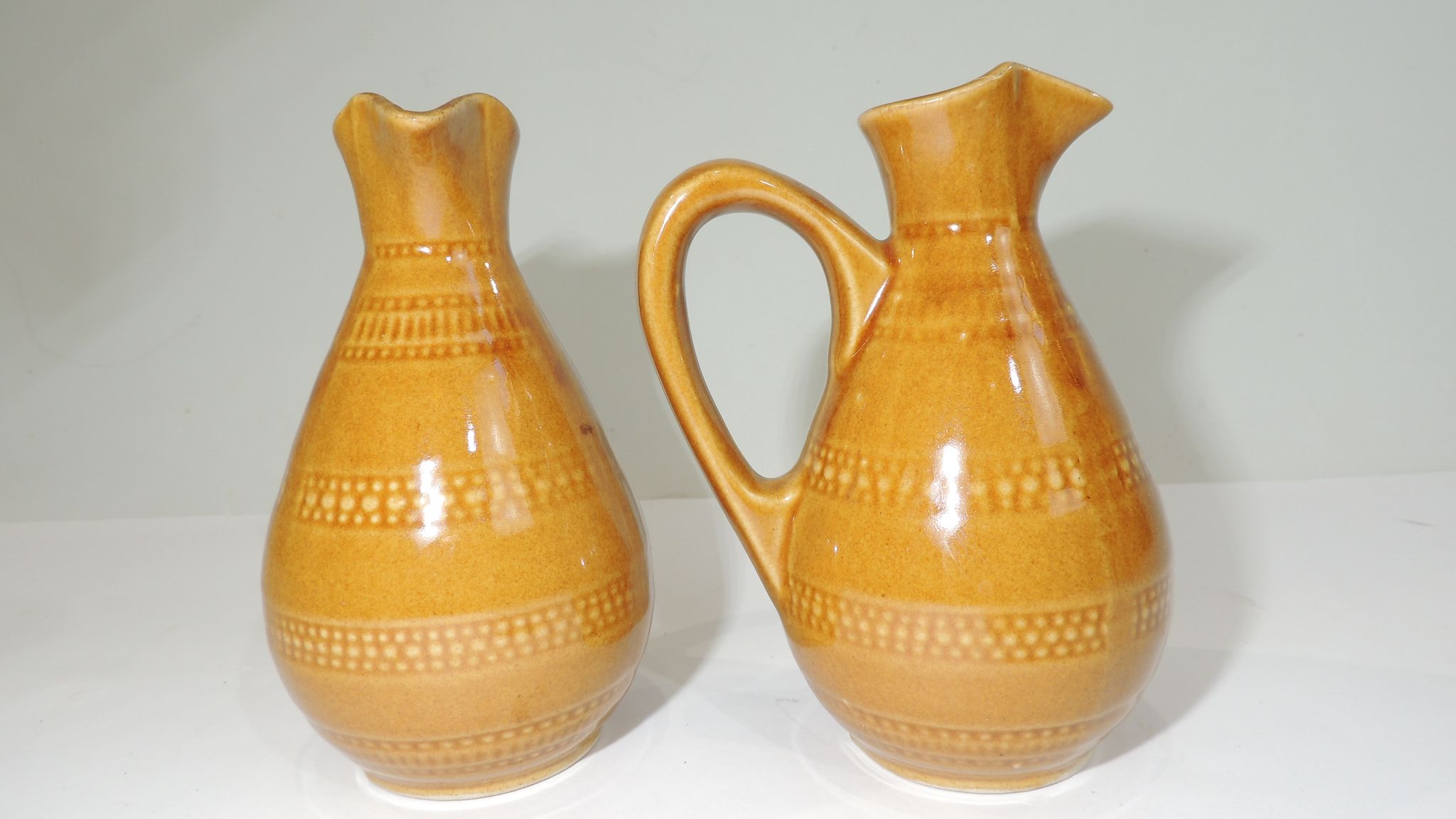 Pair of vintage stoneware pitchers
