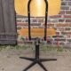 workshop chair adjustable in height, metal footing and seating and wooden back