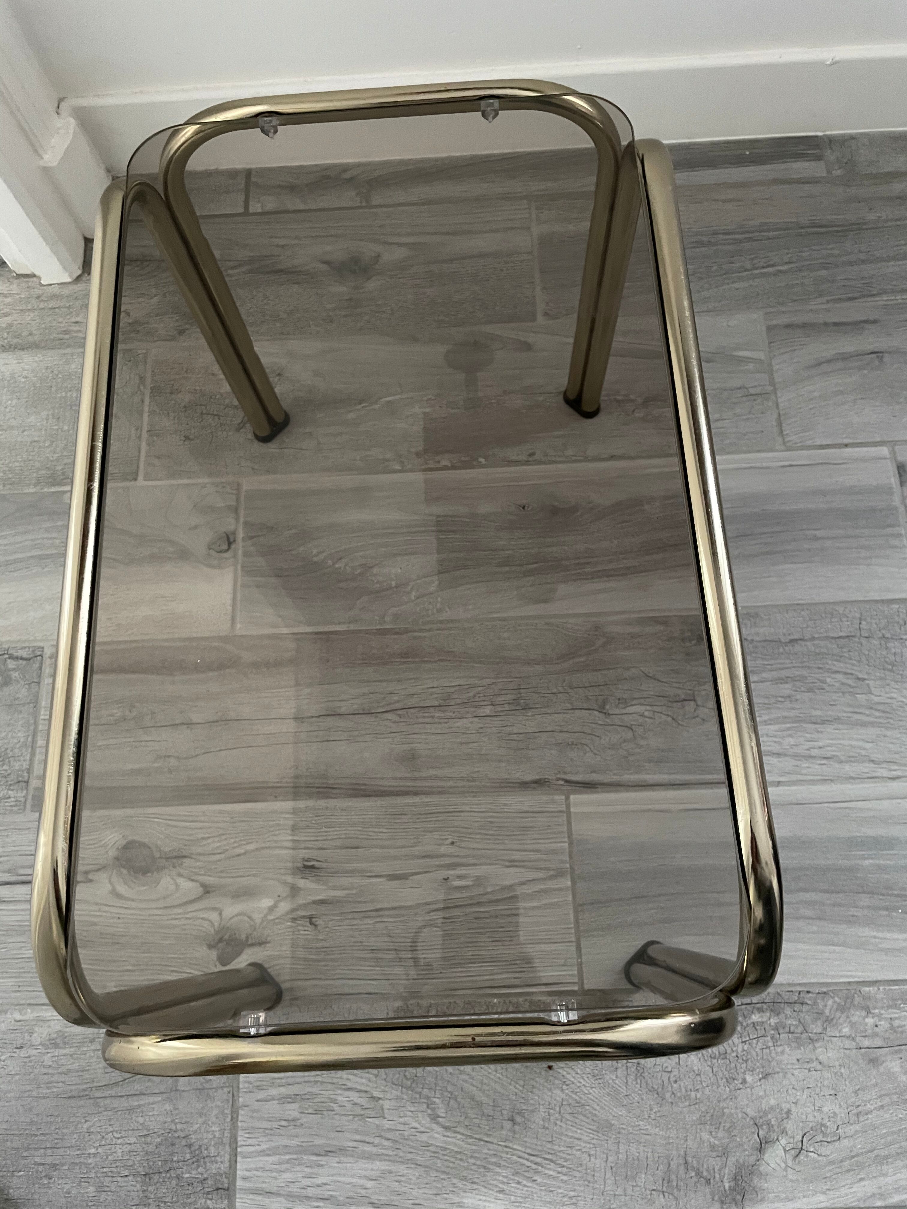 Pull-out tables in vintage smoked glass