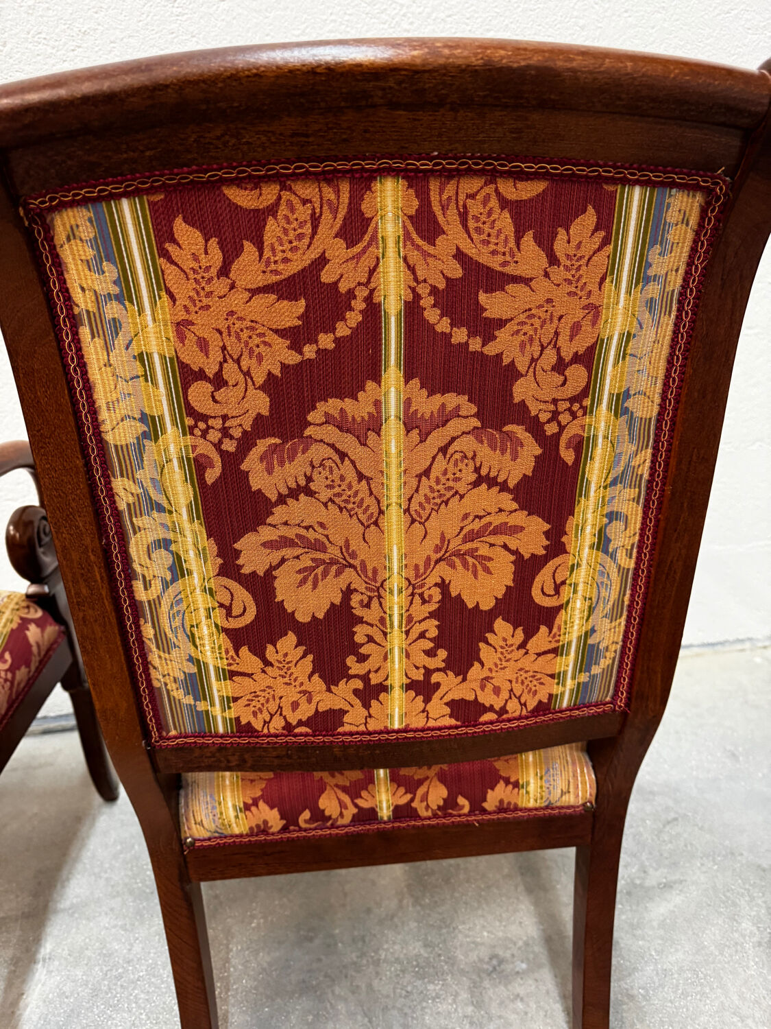 Pair of cross-back armchairs, Empire style, 19th century.
