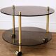 Brass and glass serving table with wheels — Art Deco style