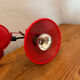 Three-lamp suspension in Memphis design style in red metal.