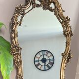 Rocaille style mirror from the 20th century in wood and gilded stucco, Putto on the pediment