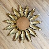 Miroir soleil métal doré