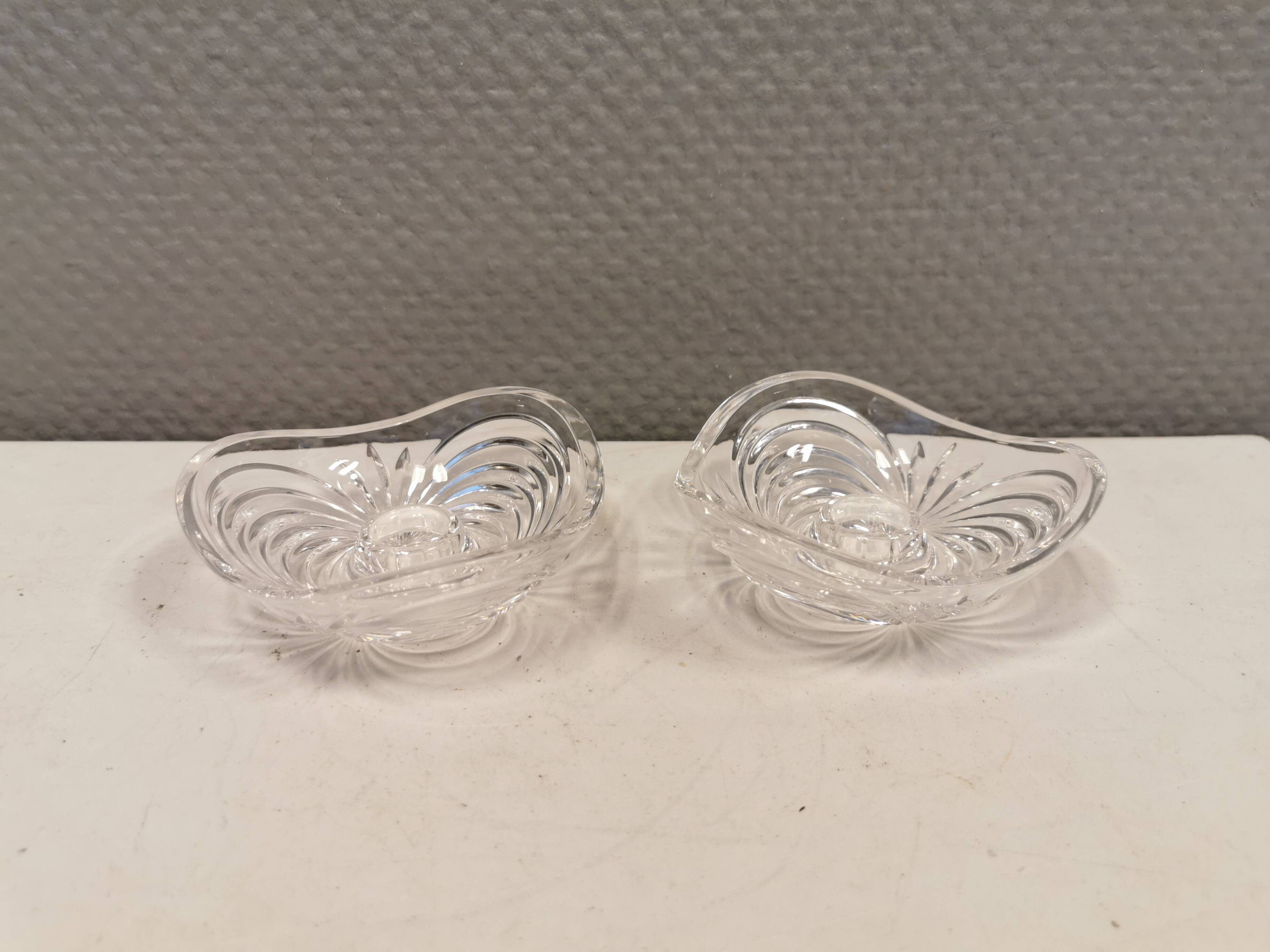 A set of beautiful rock crystal glass candle holders from Swedish Orrefors. Estimated 1970s.