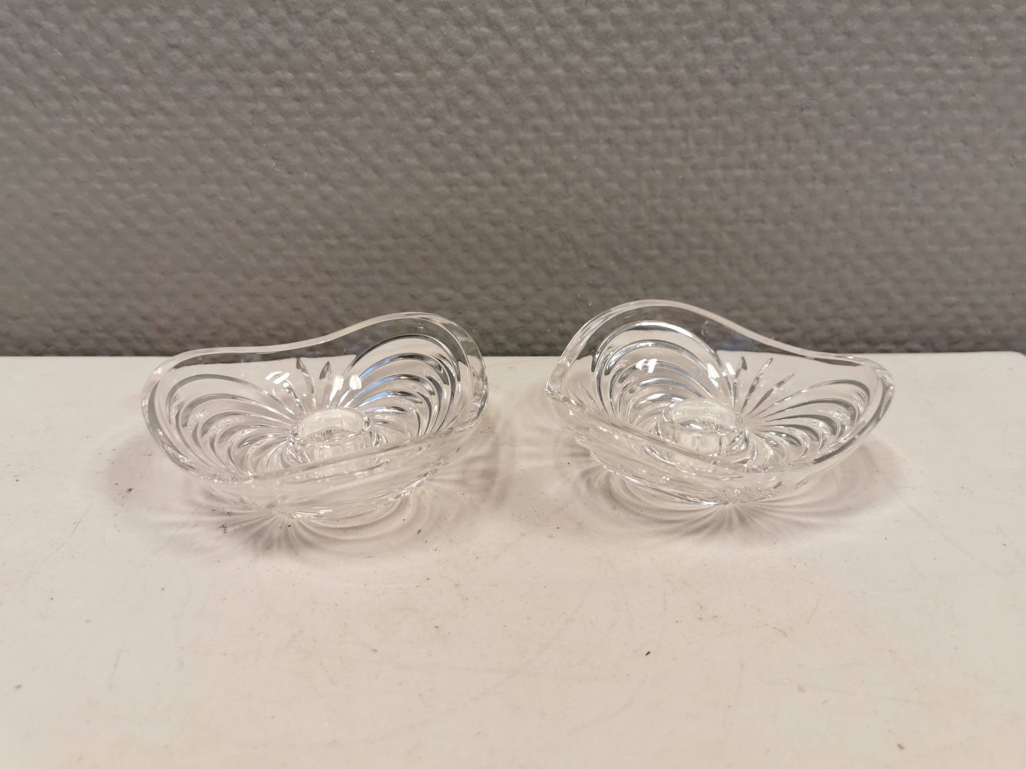 A set of beautiful rock crystal glass candle holders from Swedish Orrefors. Estimated 1970s.