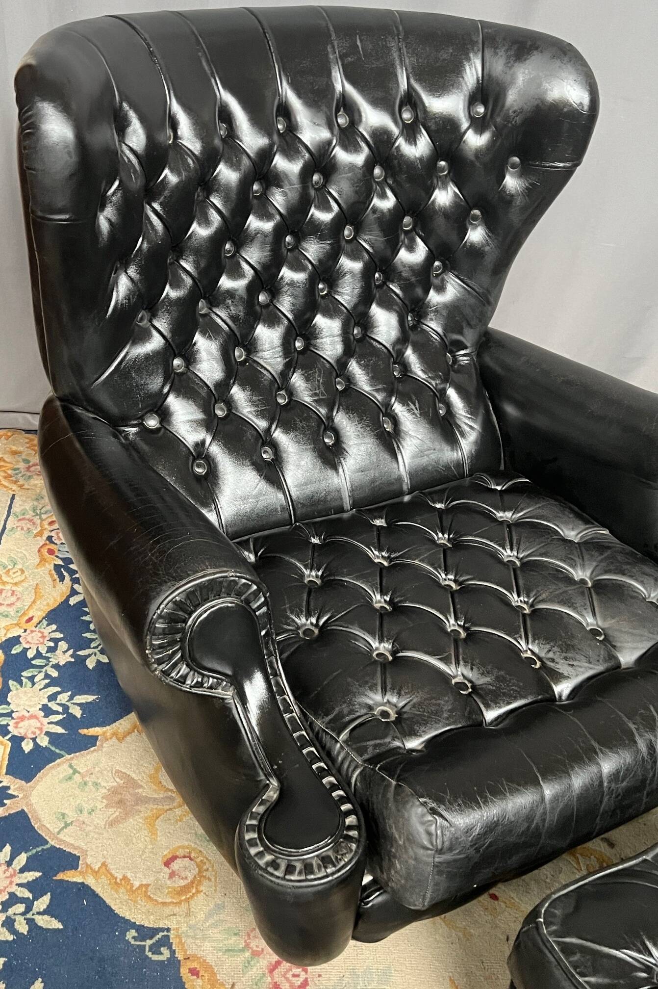 Chesterfield armchair and ottoman. Leather.