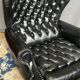 Chesterfield armchair and ottoman. Leather.