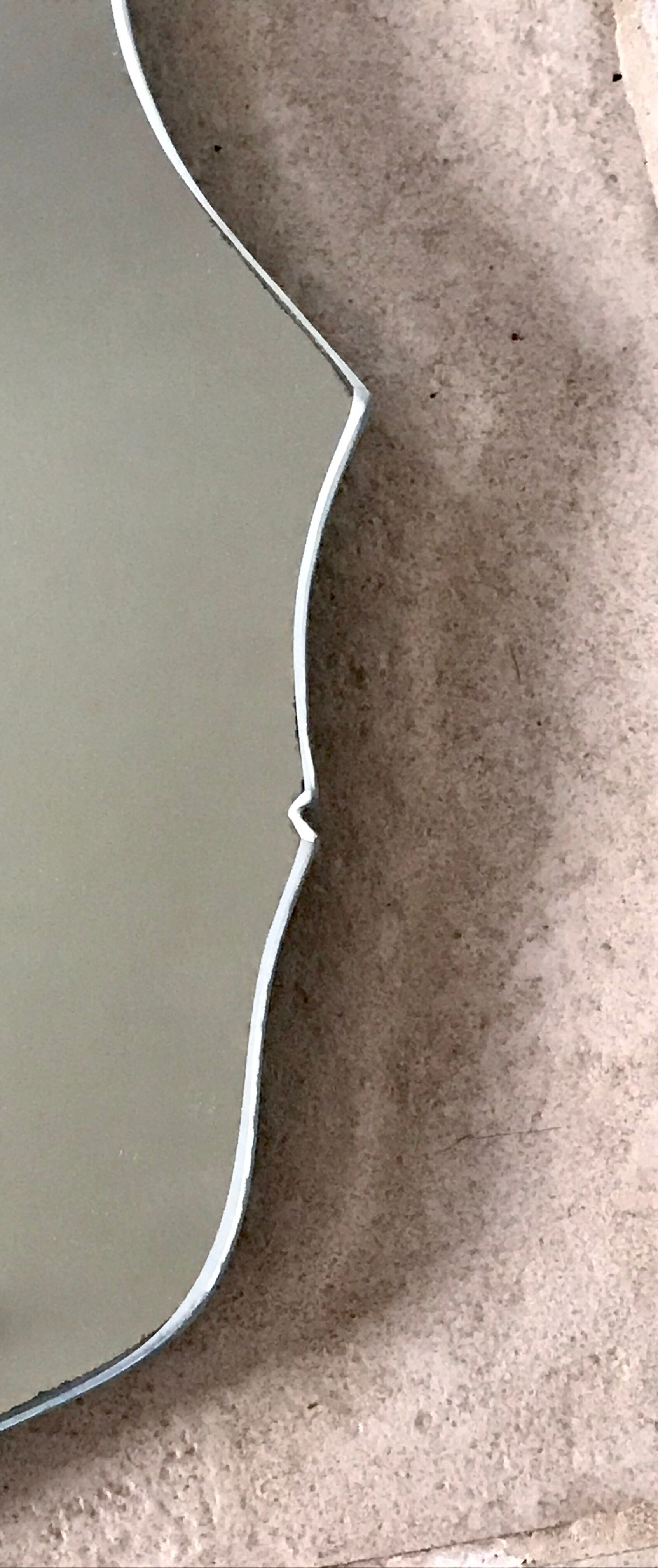 Free-form mirror signed Mathias 55x59cm