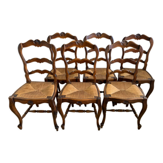 6 wooden chairs and straw seat