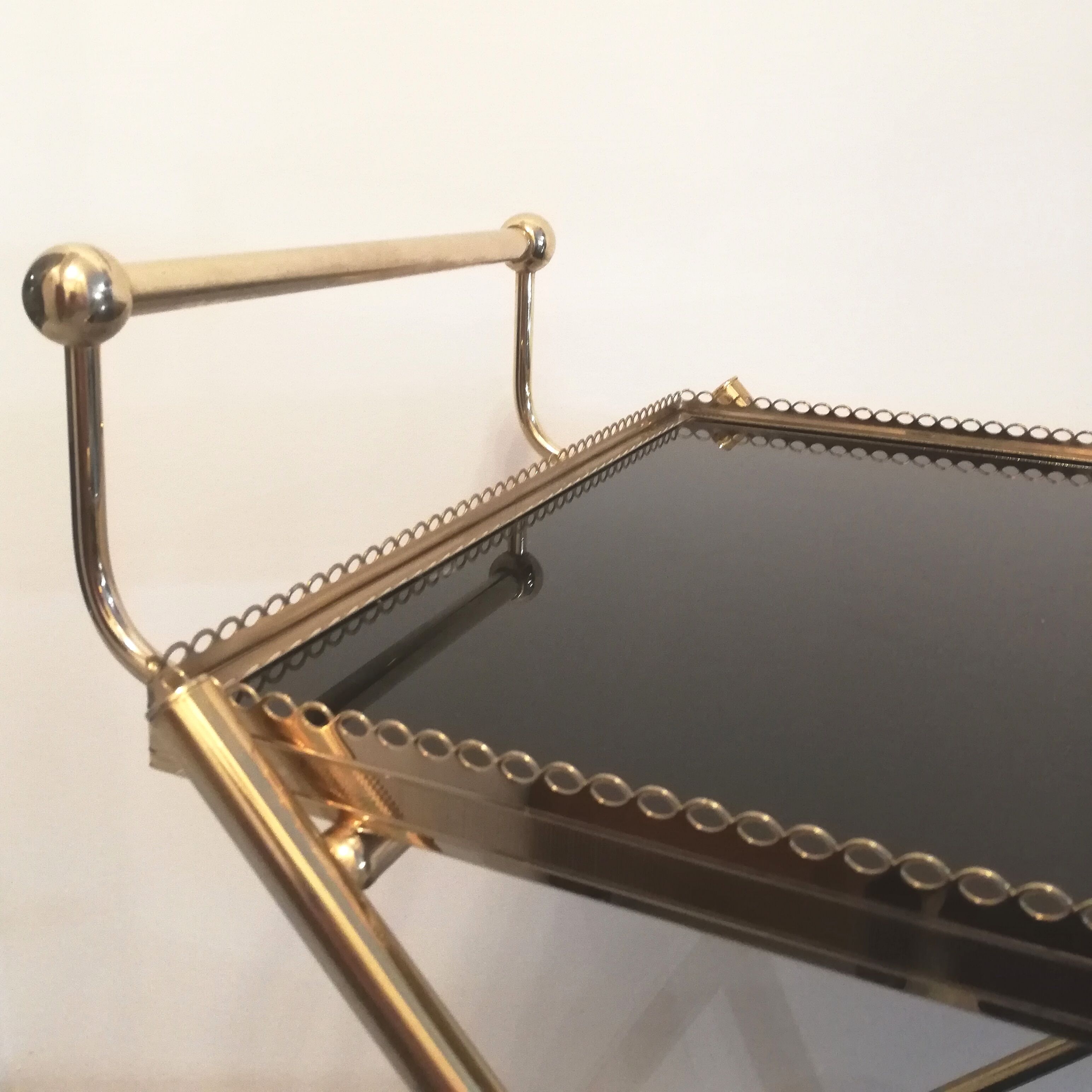 Golden brass trolley wheeled dessert and glass trays
