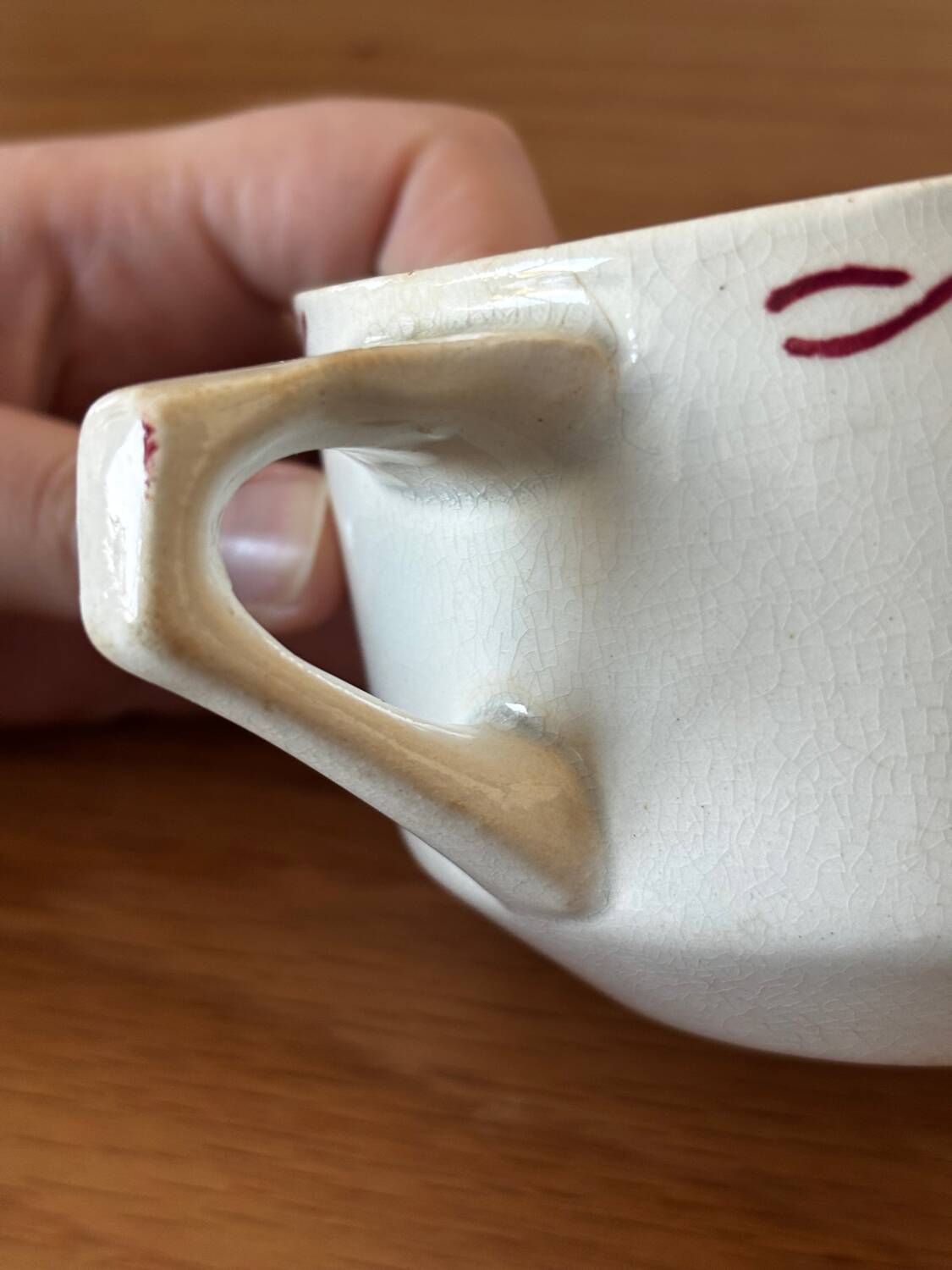 Vintage old sauceboat with pink flowers in St Amand