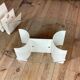 White lacquered metal magazine rack from the 1970s
