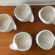 Teapot and cups in contemporary ceramic