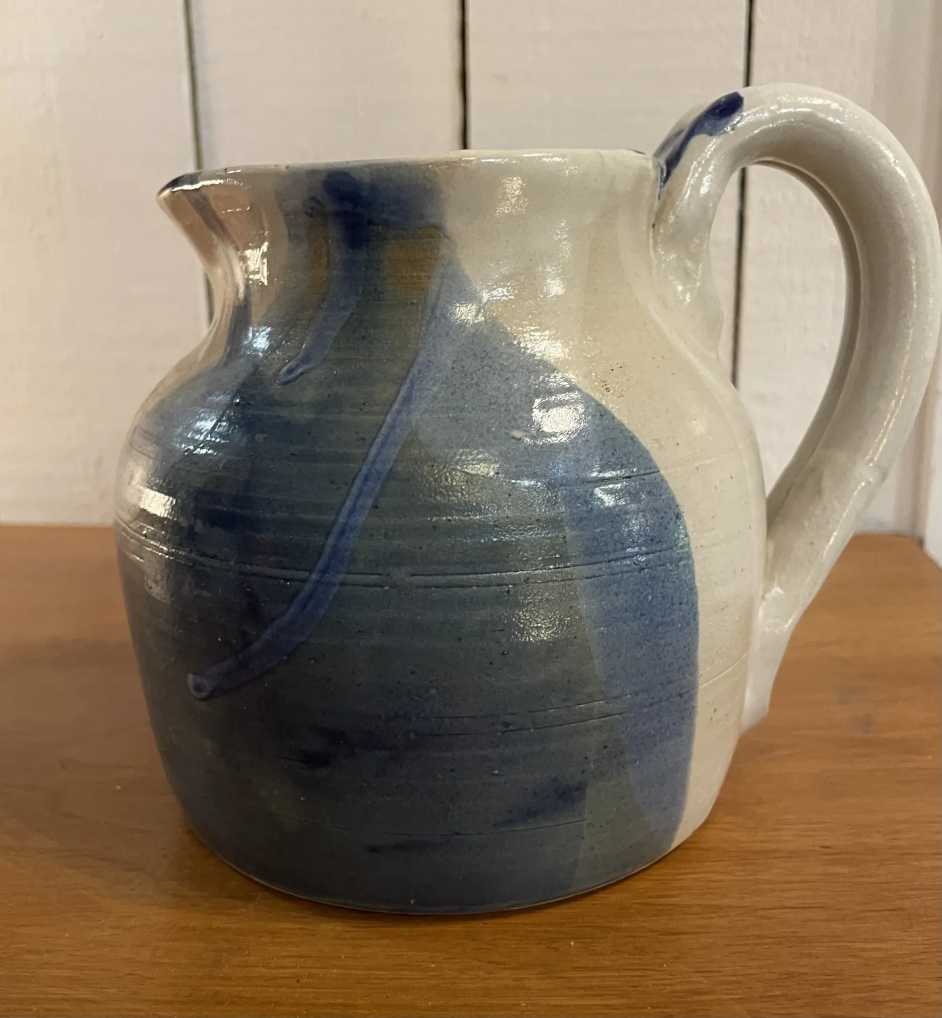 Beige and blue stoneware jug