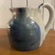Beige and blue stoneware jug