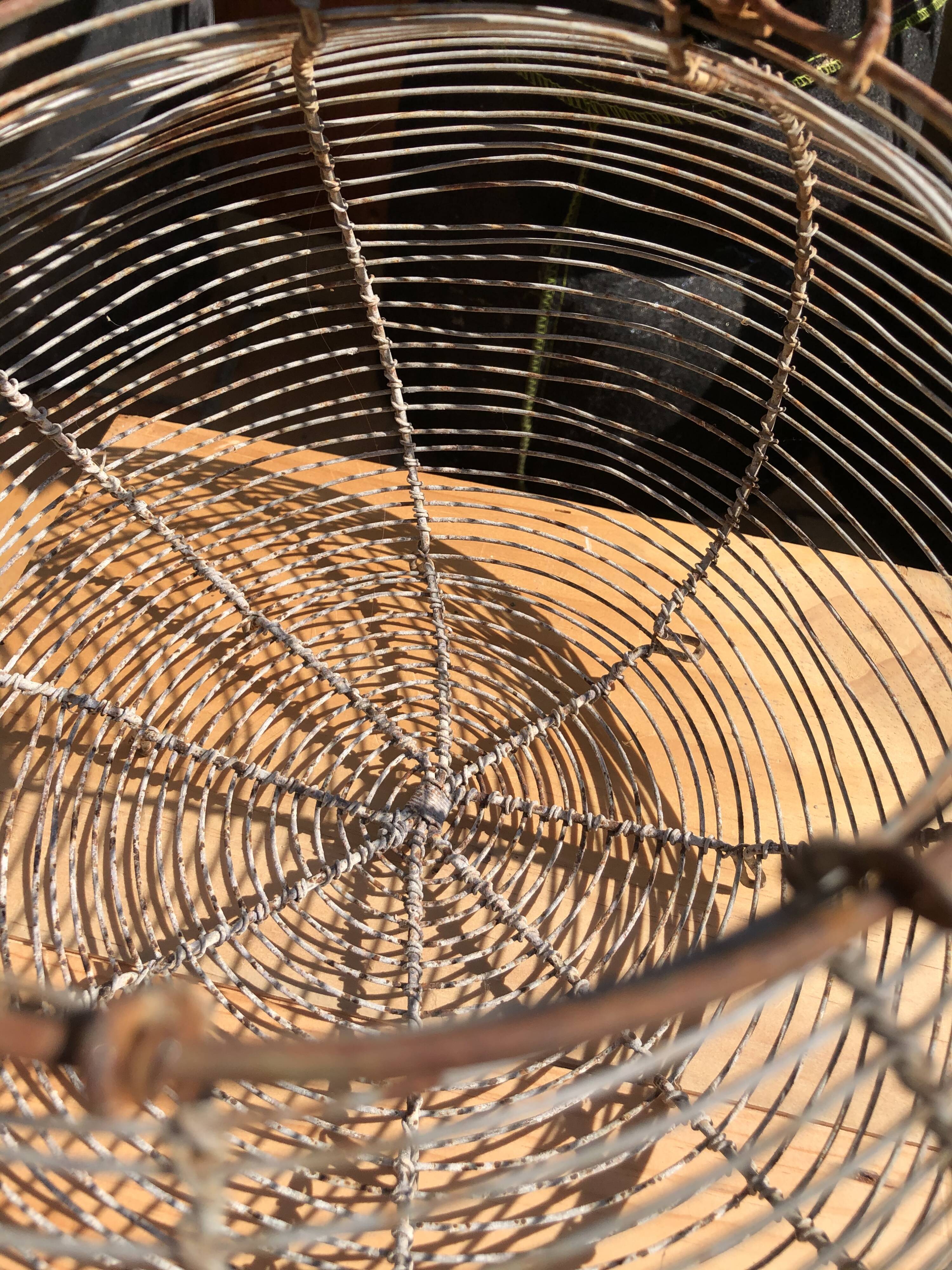 Old egg basket in metal shape round metal handle