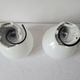 Duo of art deco wall lamps in porcelain and opaline