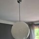 Suspended light white glass globe