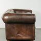 Set of a smooth chesterfield sofa and armchair with a timeless English look