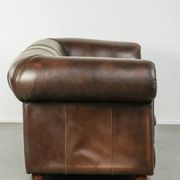 Set of a smooth chesterfield sofa and armchair with a timeless English look