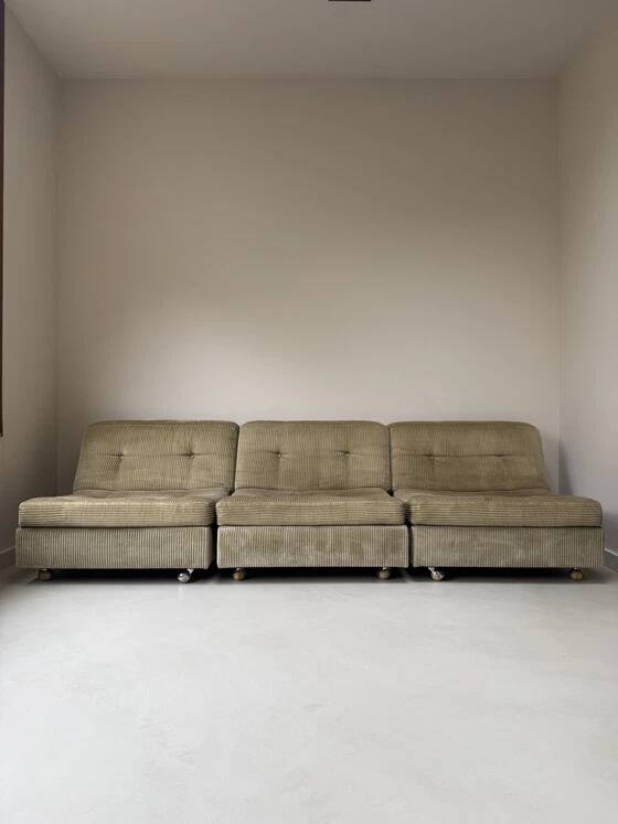 Three vintage seating elements with corduroy fabric