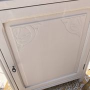Beautiful art deco jam cupboard in delicate beige tone / and wicker basket