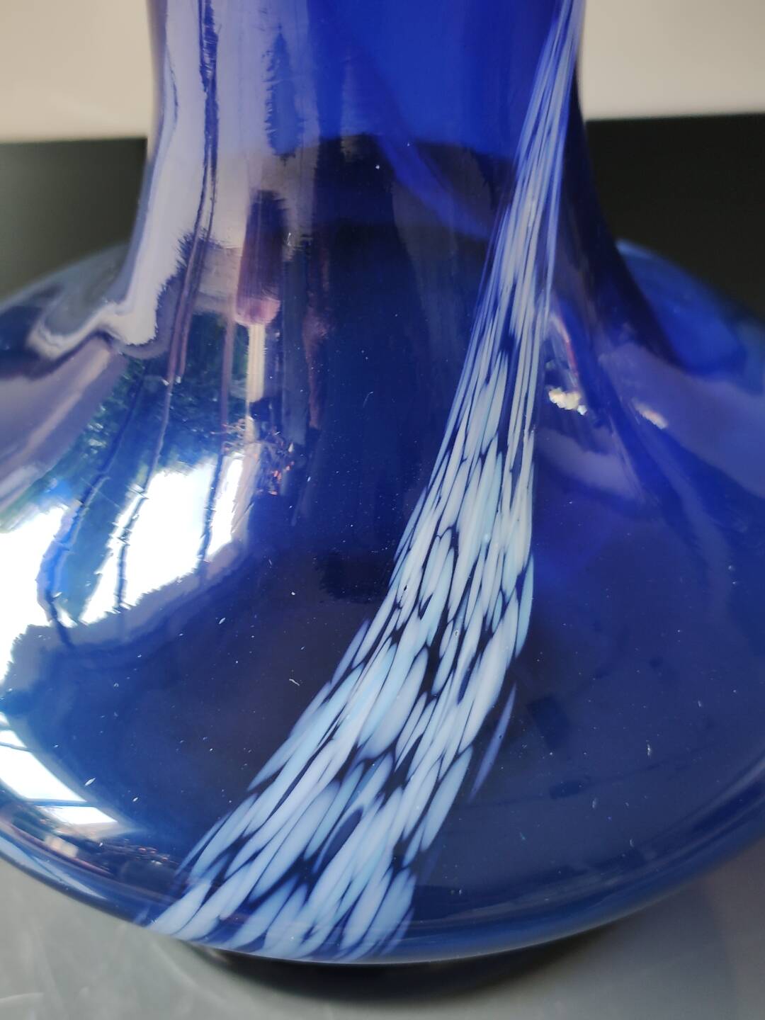 Long flared neck ball vase. Smoked scrolls in cobalt blue art glass, 30cm