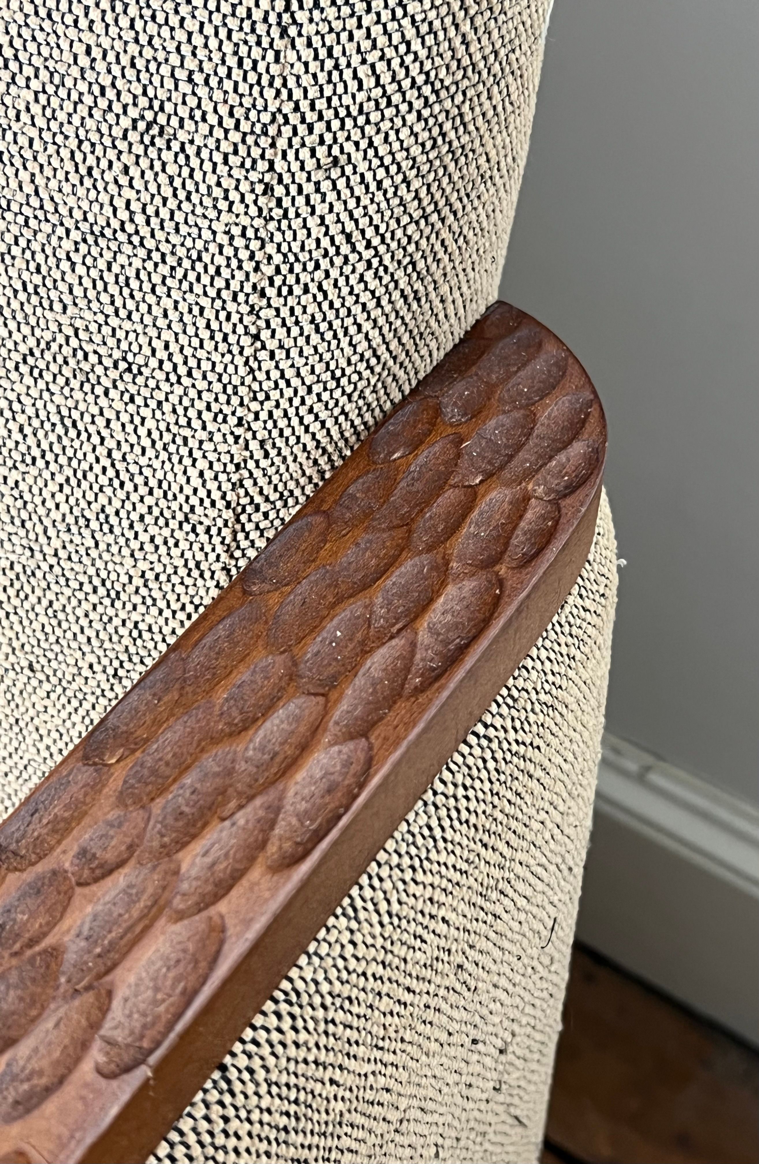 Pair of armchairs in carved wood and vintage fabric