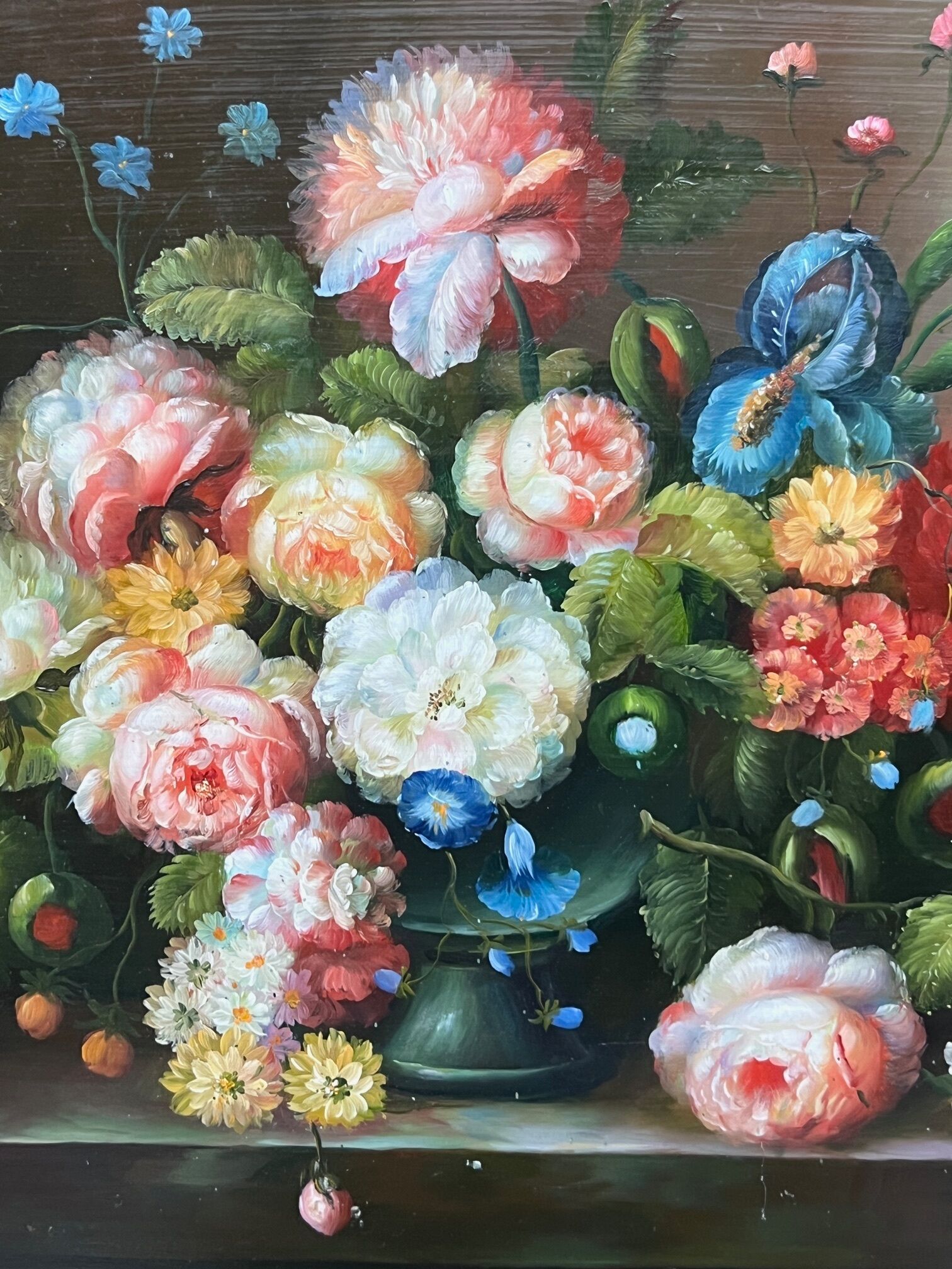 Still life with roses in a beautiful frame on a wooden panel in Flemish style.