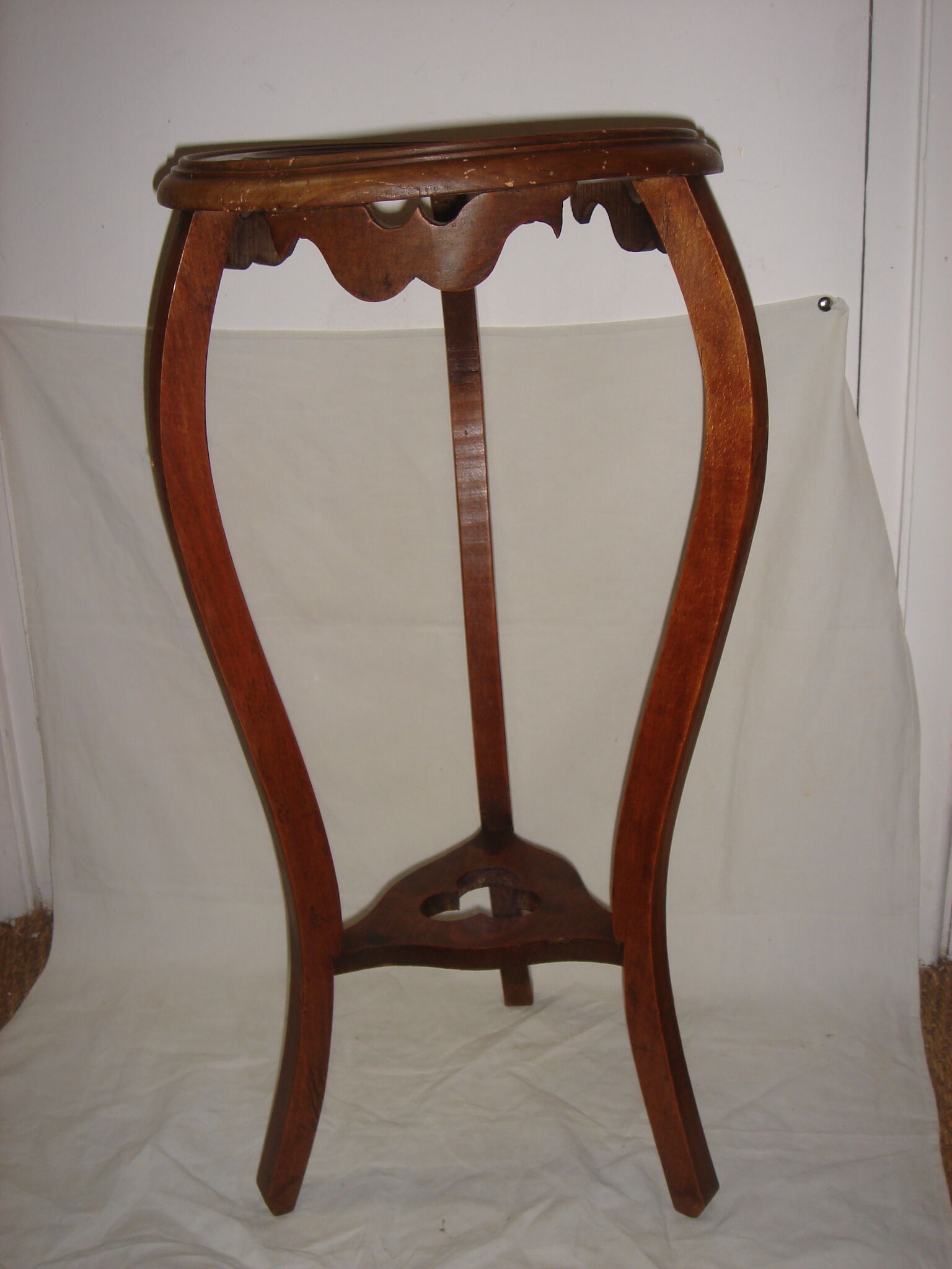 Harness plant dating back to early 20th end table wooden