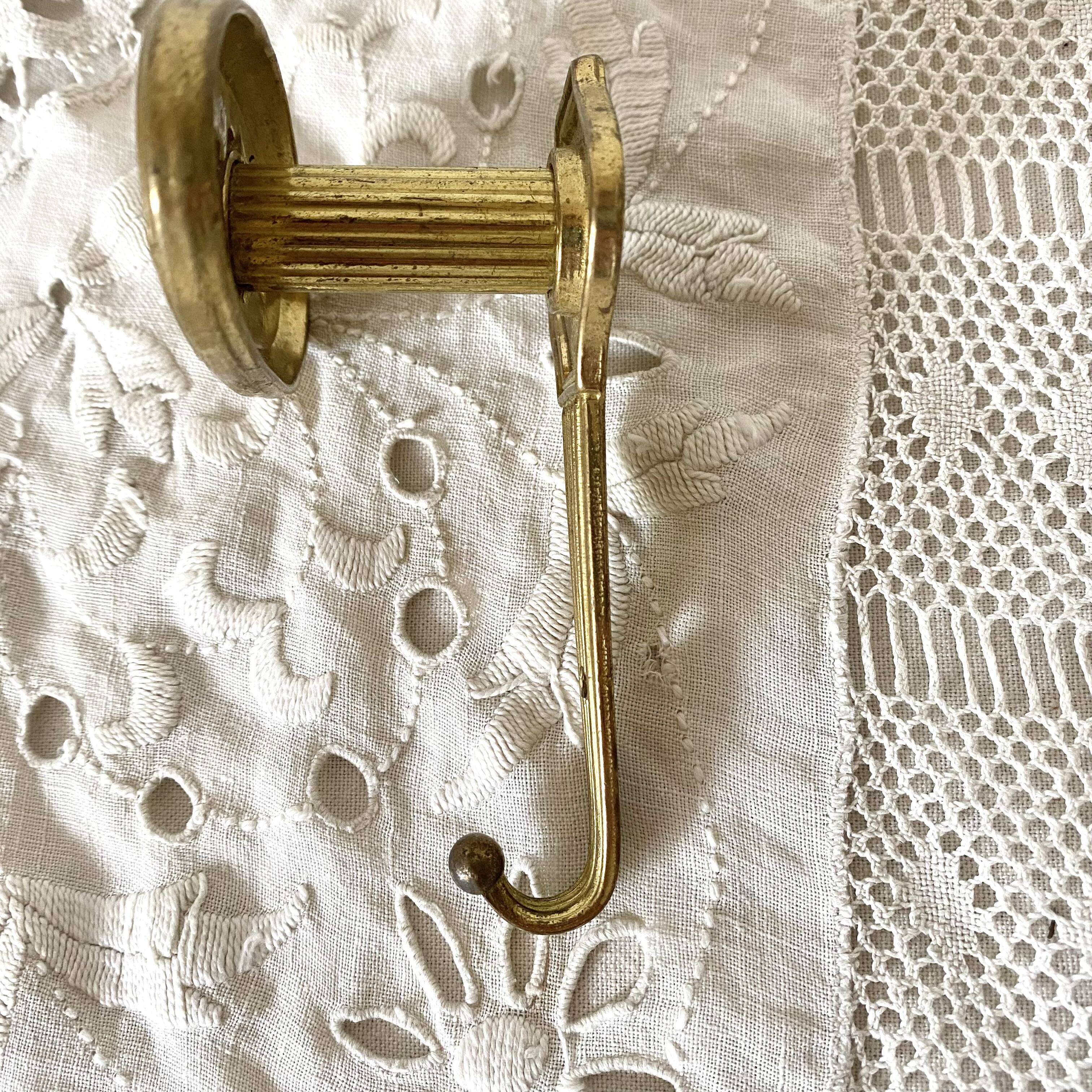 Golden brass coat hook