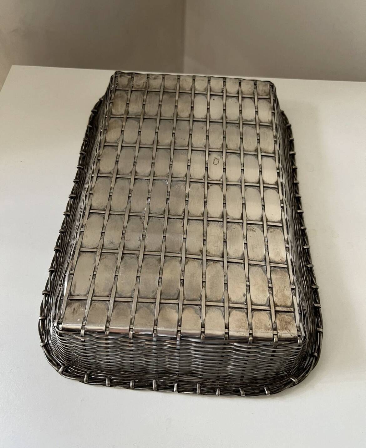 Woven silver metal bread basket